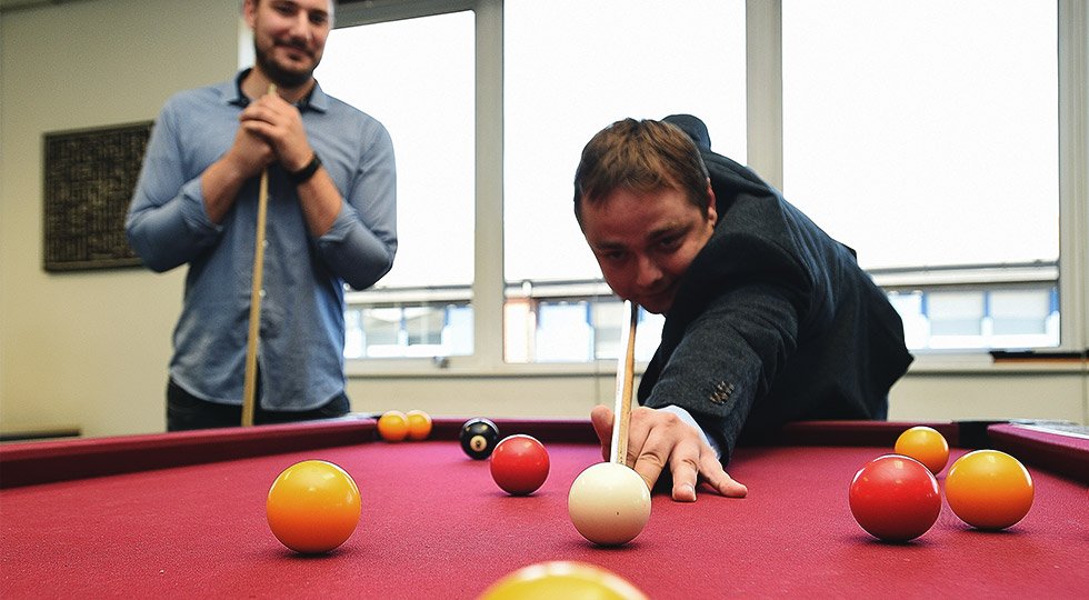 re staff playing pool